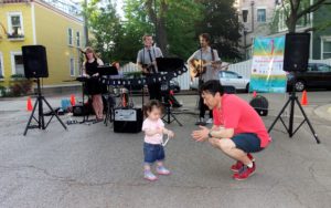 child and man in front of a band