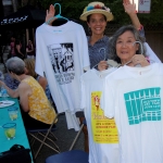 two women holding art fair t-shirts